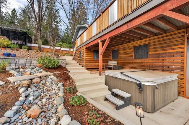 a view of a two chairs in the patio