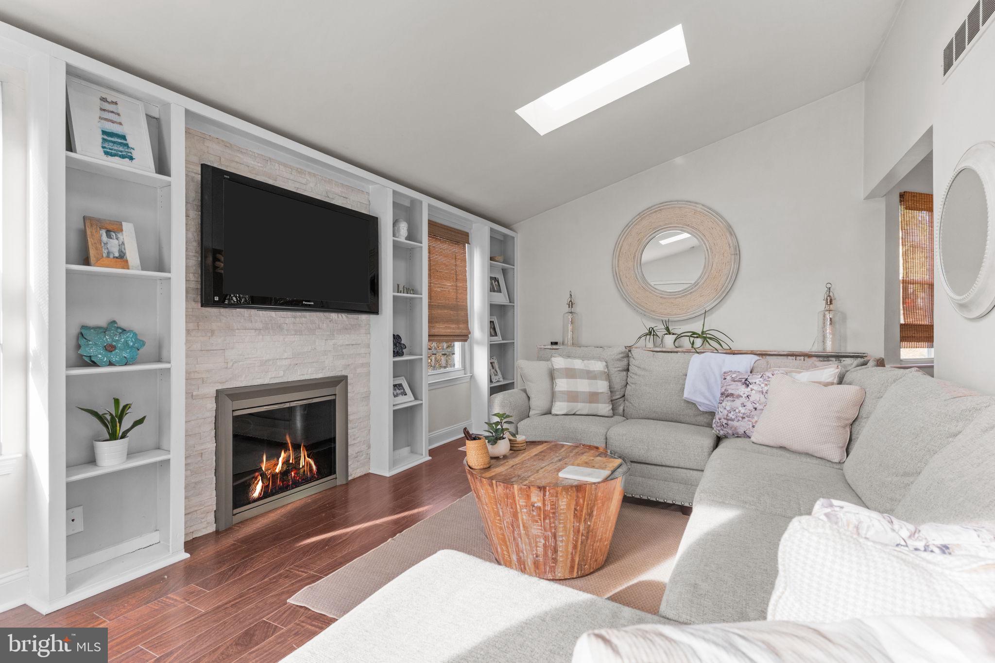 105 South Timber Road Holland, PA 18966 - Photo 13 of 34 a living room with furniture a flat screen tv and a fireplace