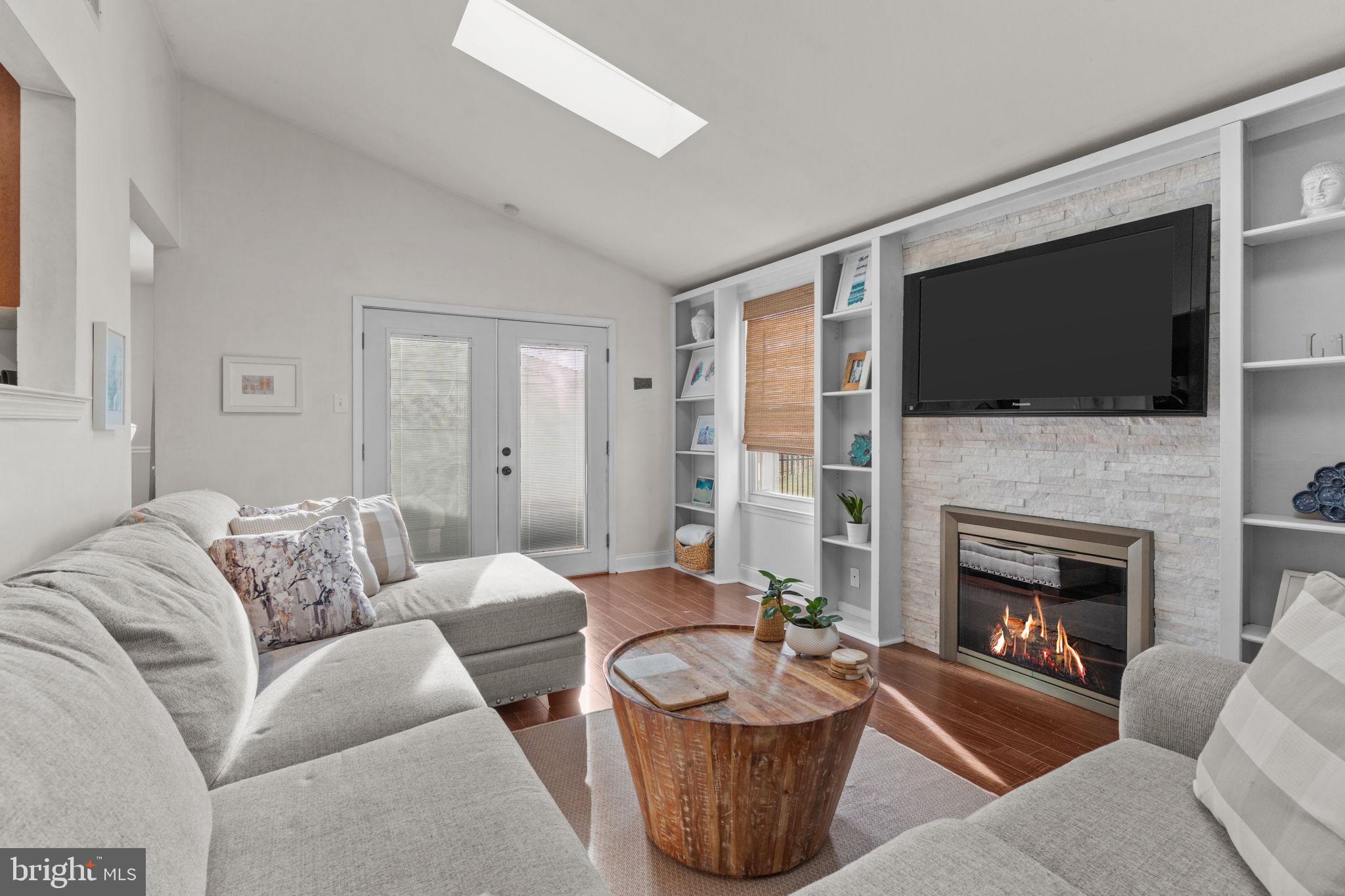 105 South Timber Road Holland, PA 18966 - Photo 15 of 34 a living room with furniture a flat screen tv and a fireplace