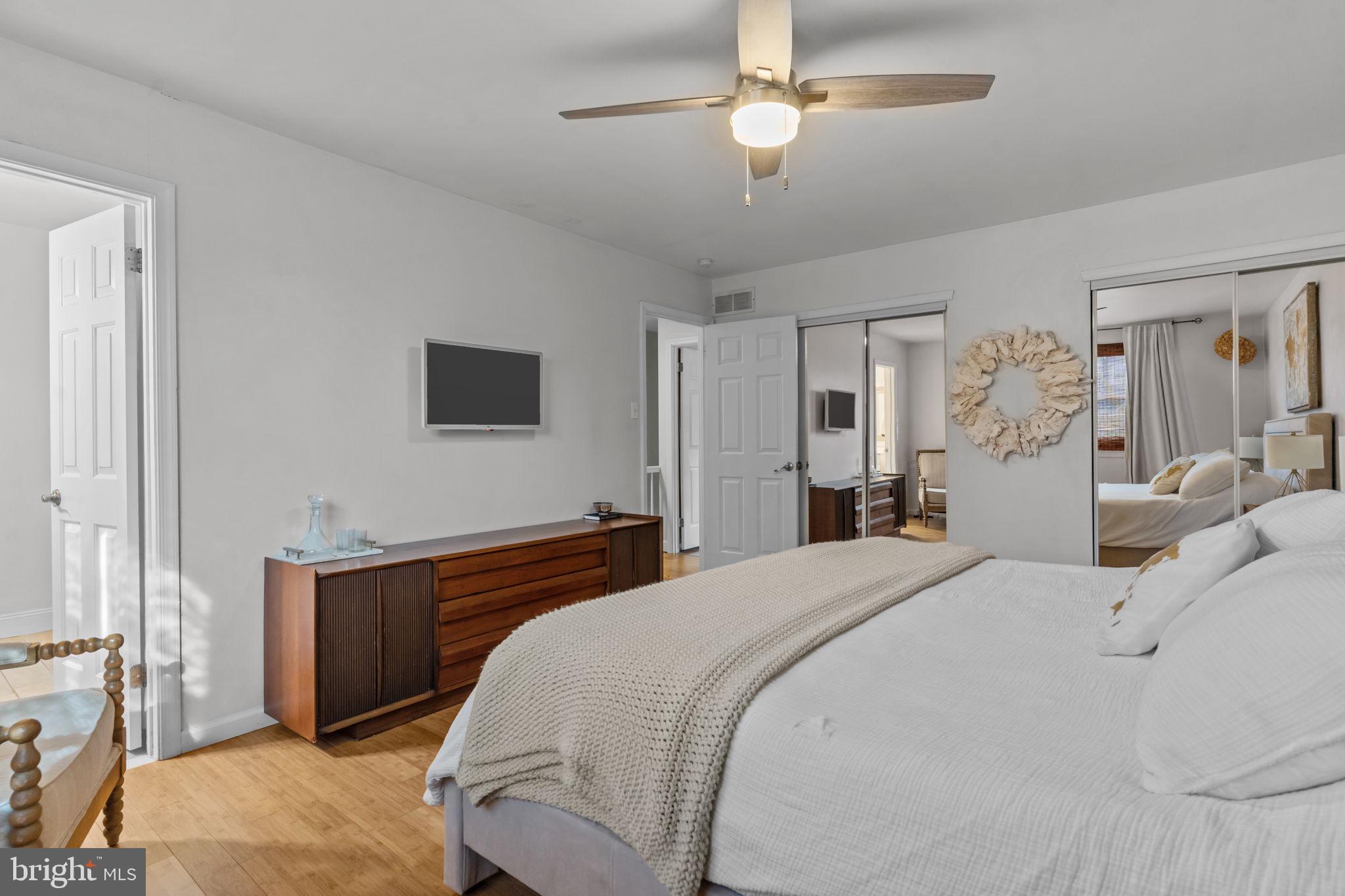 105 South Timber Road Holland, PA 18966 - Photo 19 of 34 a bedroom with a bed and a chandelier