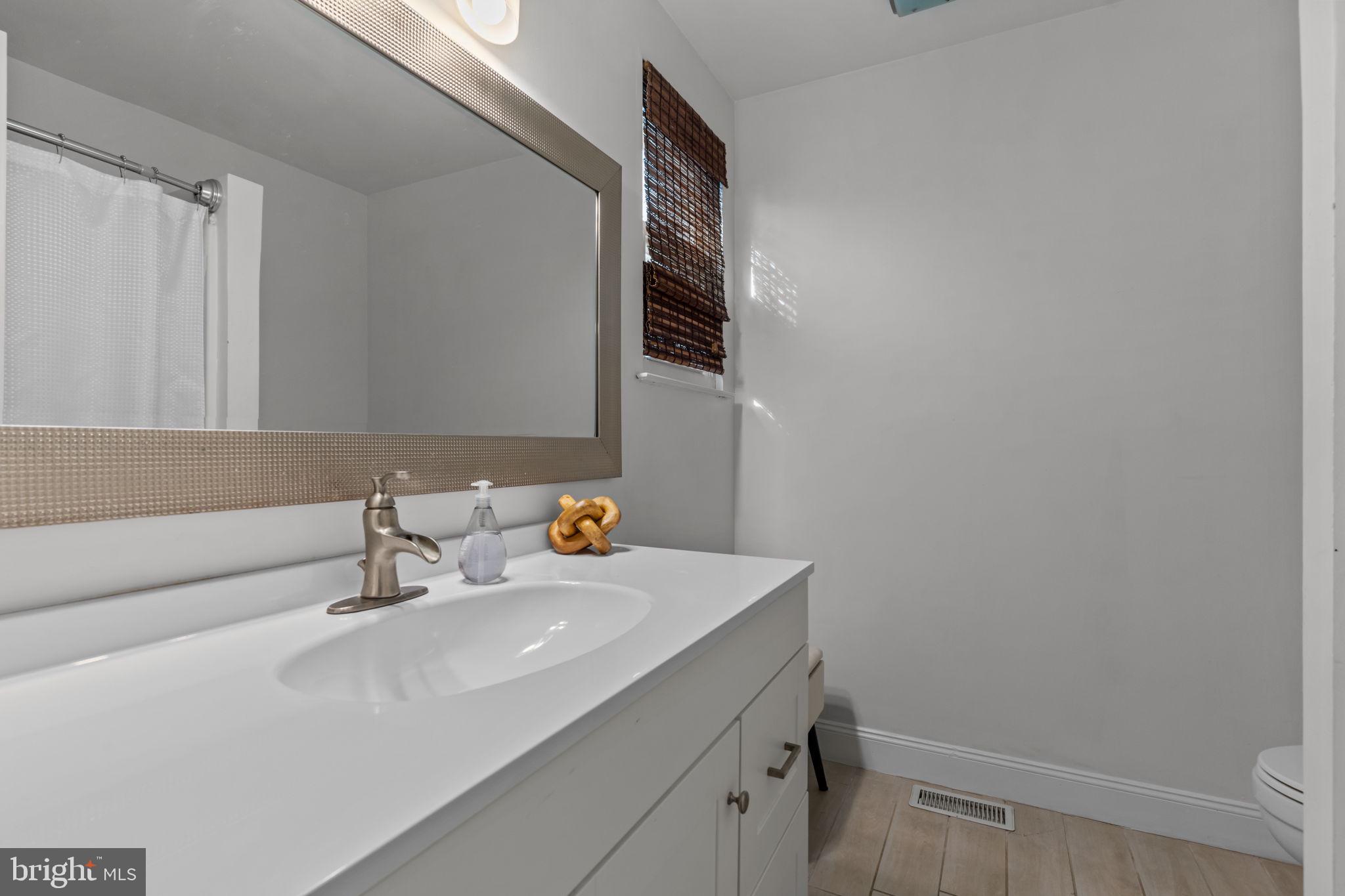 105 South Timber Road Holland, PA 18966 - Photo 20 of 34 a bathroom with a sink and a mirror