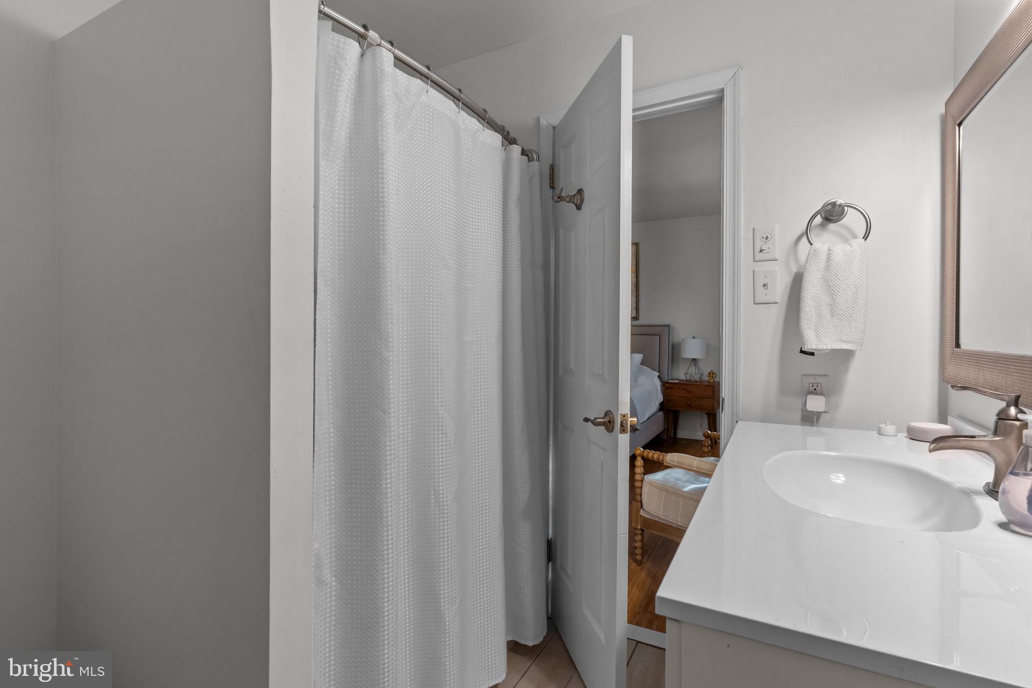105 South Timber Road Holland, PA 18966 - Photo 21 of 34 a bathroom with a sink a mirror and a shower