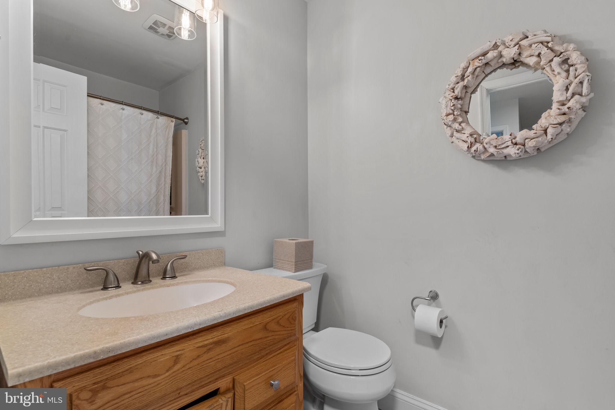 105 South Timber Road Holland, PA 18966 - Photo 24 of 34 a bathroom with a granite countertop sink and a mirror