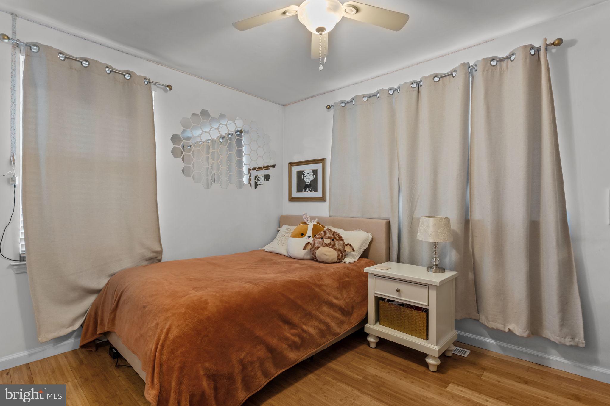 105 South Timber Road Holland, PA 18966 - Photo 25 of 34 a bedroom with a bed and a mirror on the dresser