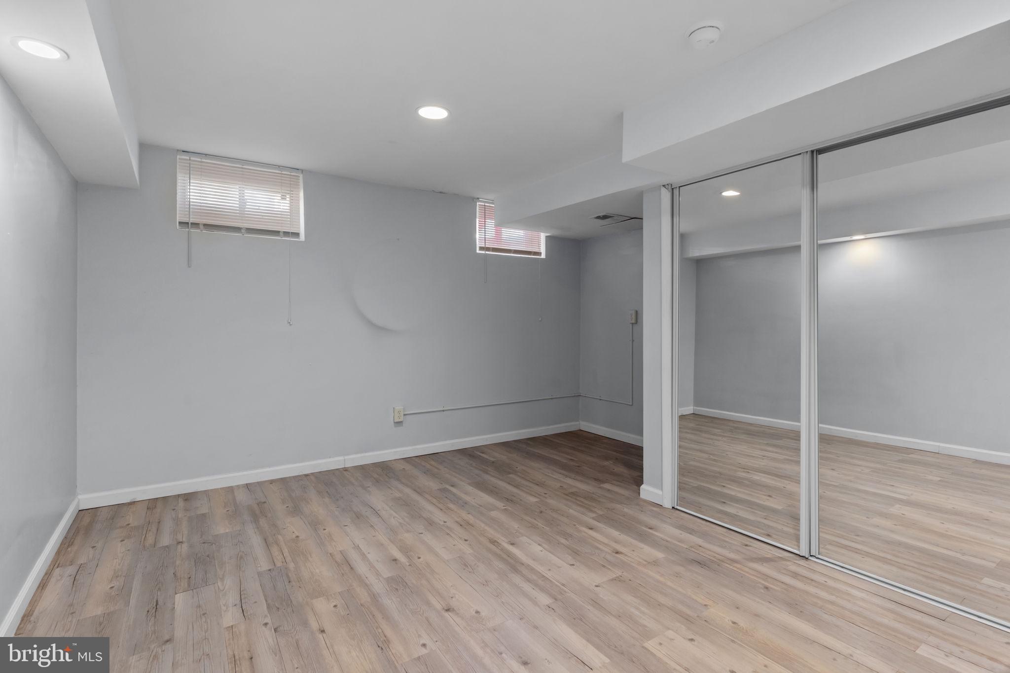 105 South Timber Road Holland, PA 18966 - Photo 27 of 34 an empty room with wooden floor and windows