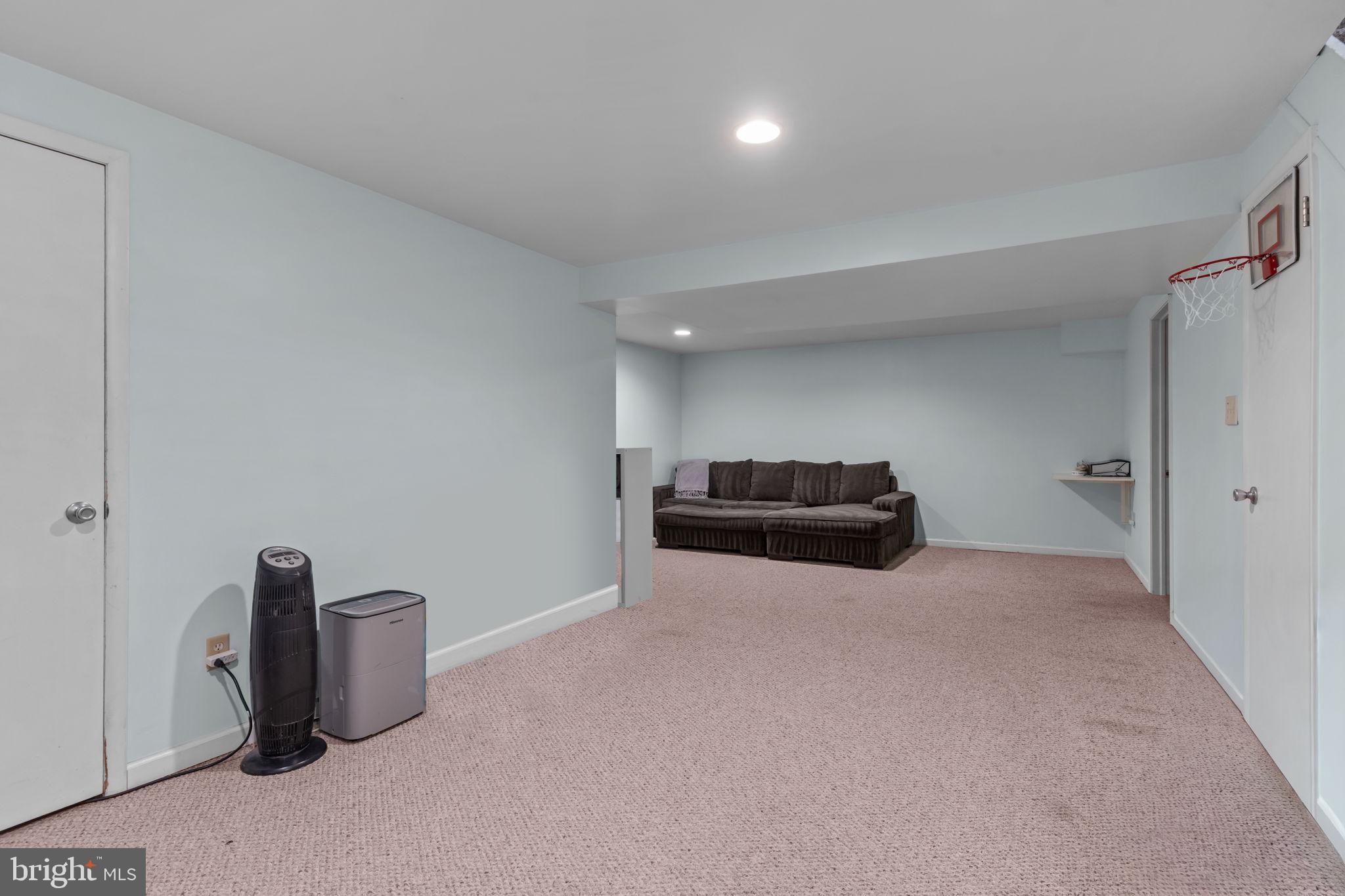 105 South Timber Road Holland, PA 18966 - Photo 30 of 34 a living room with furniture and a flat screen tv