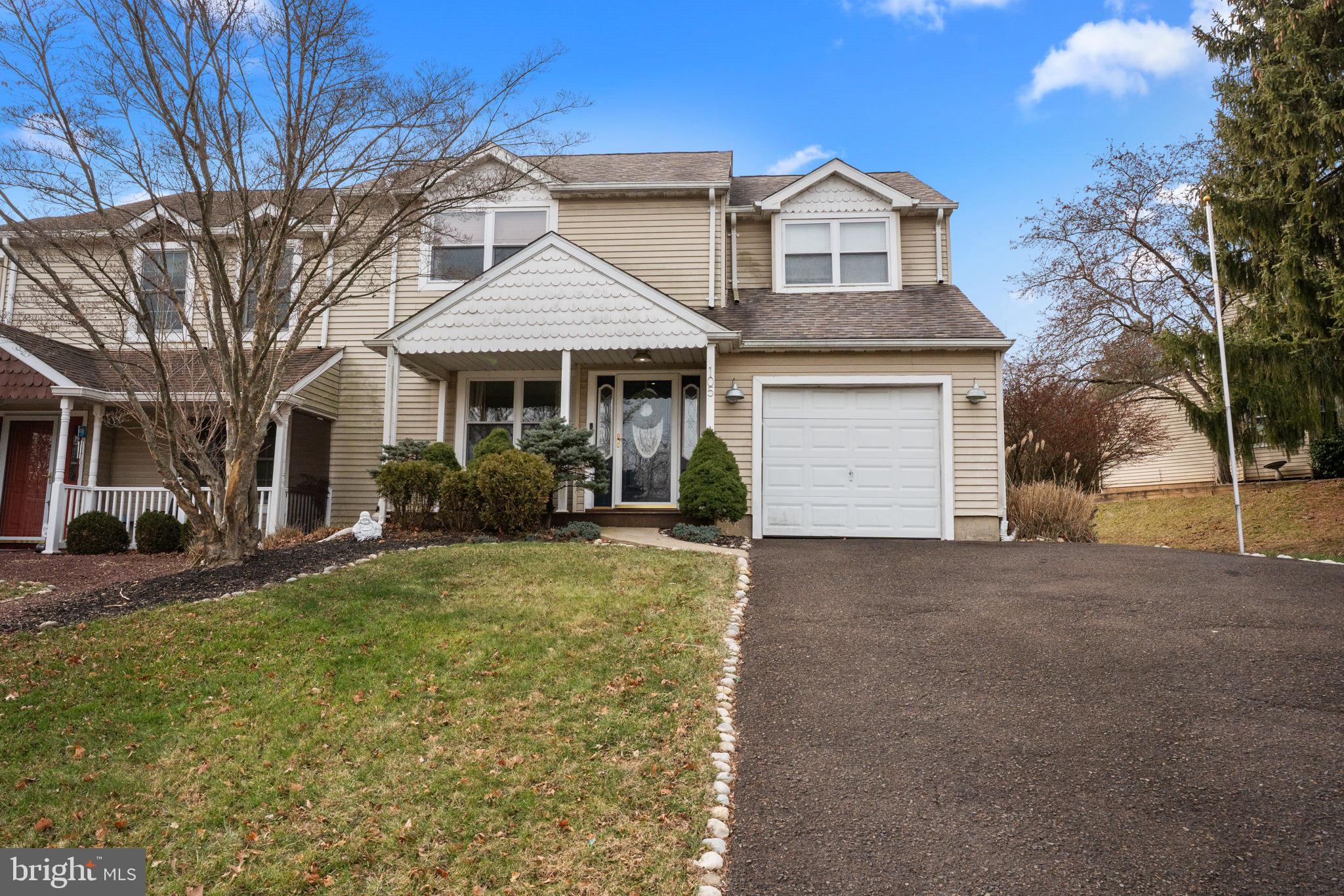 105 South Timber Road Holland, PA 18966 - Photo 34 of 34 a front view of a house with a yard and garage