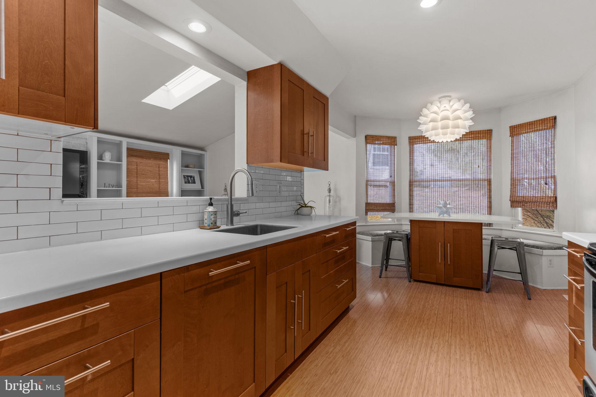 105 South Timber Road Holland, PA 18966 - Photo 8 of 34 a kitchen with stainless steel appliances granite countertop a sink dishwasher stove and wooden cabinets