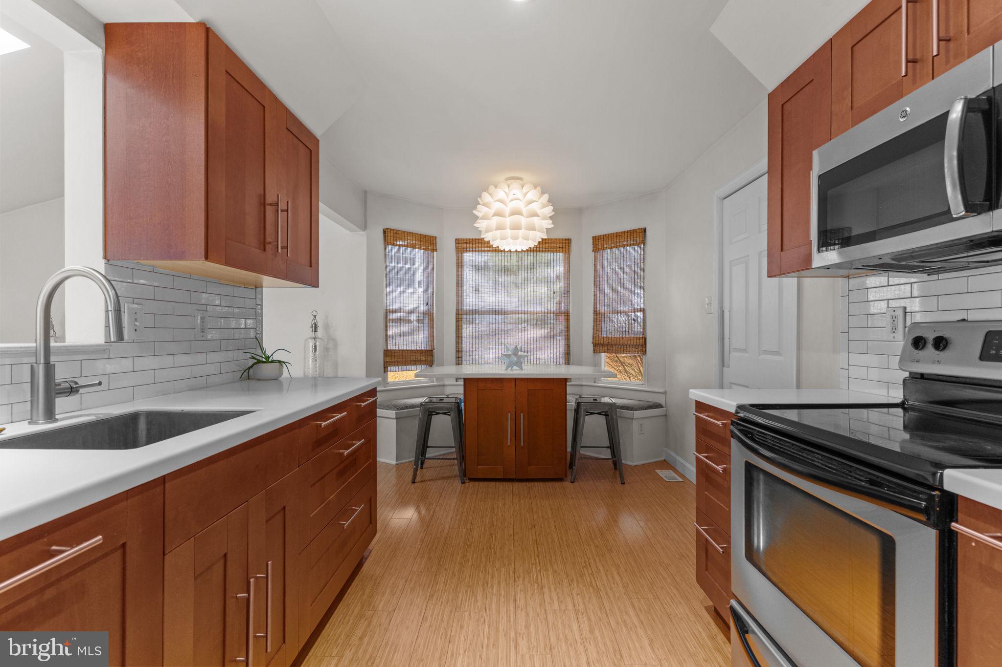 105 South Timber Road Holland, PA 18966 - Photo 9 of 34 a kitchen with stainless steel appliances a sink stove and cabinets