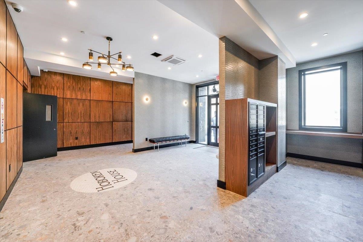 237 Washington Street, Unit 204 Hoboken, NJ 07030 - Photo 28 of 34 a view of a refrigerator in kitchen and utility room
