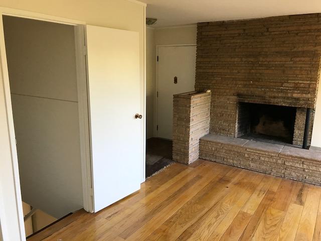 164 Bardet Road Woodside, CA 94062 - Photo 6 of 17 a bedroom with a bed and a fireplace