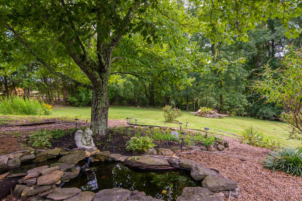 7129 Swift Road Greenbrier, TN 37073 - Photo 14 of 25 a view of a garden with large trees