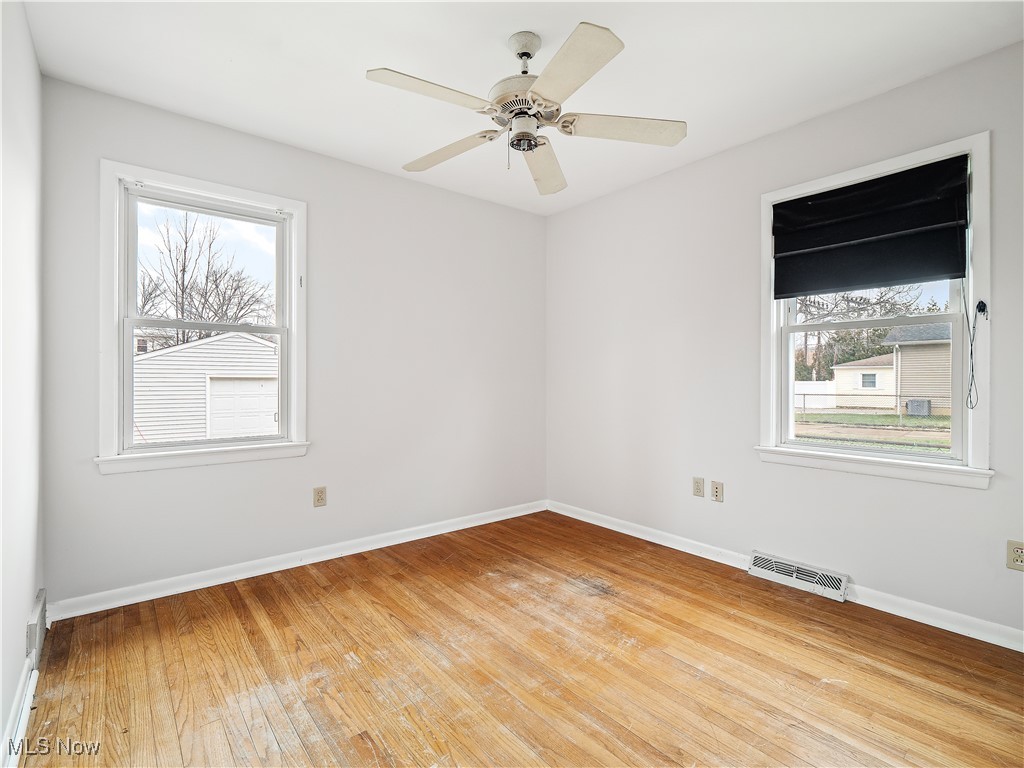 23812 Knickerbocker Road Bay Village, OH 44140 - Photo 17 of 31 Unfurnished room with ceiling fan and light wood-type flooring