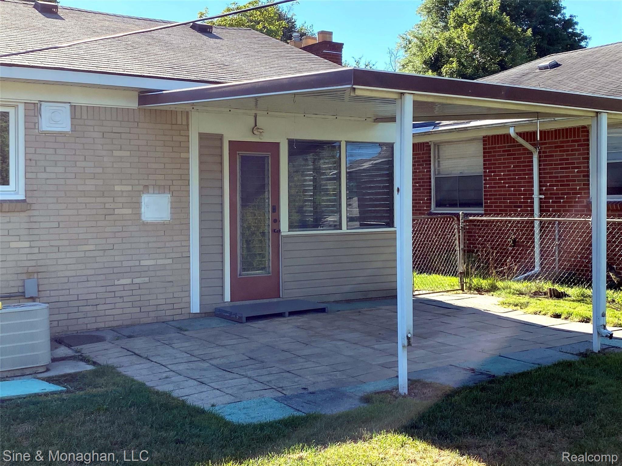56 Maplefield Road Pleasant Ridge, MI 48069 - Photo 14 of 14 Covered patio...door leads to 10' by 10' three season room with access to kitchen and attached garage