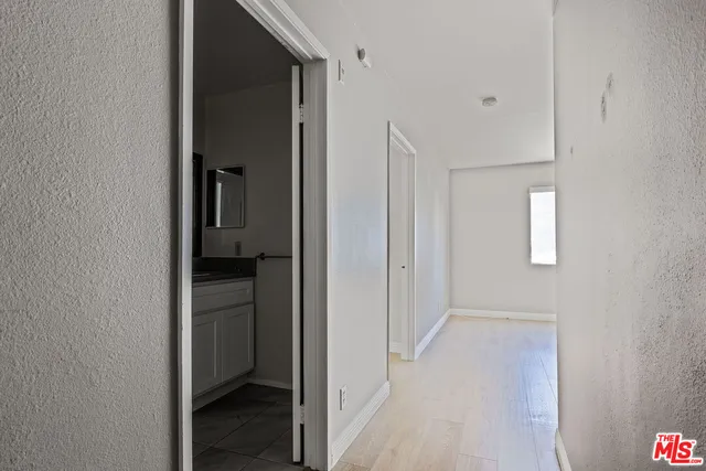 a view of a bathroom from the hallway