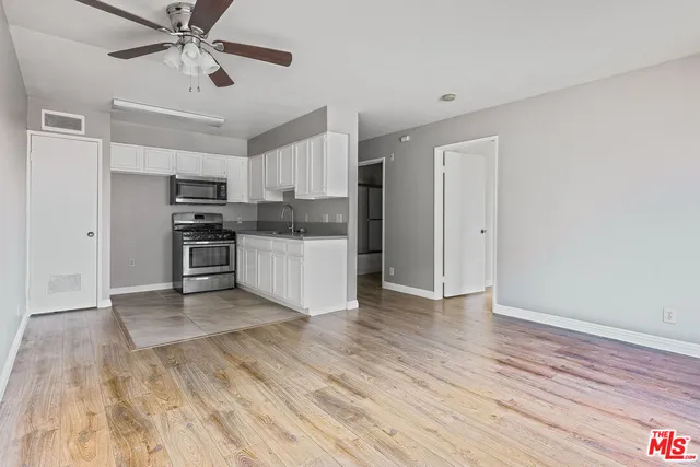 a view of cabinets and wooden floor