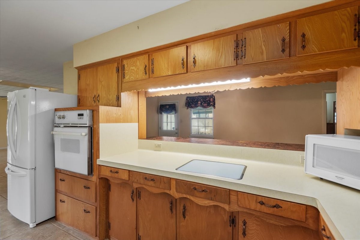 20311 Ramsey Road Crosby, TX 77532 - Photo 17 of 43 Look at that built in cutting board!!!