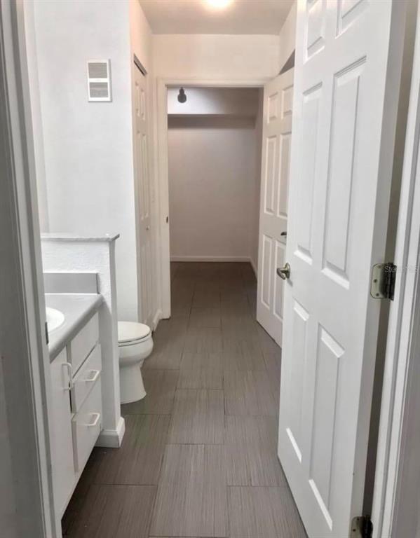 823 Camargo Way, Unit 112 Altamonte Springs, FL 32714 - Photo 5 of 6 a view of a bathroom with a hardwood floor and a sink