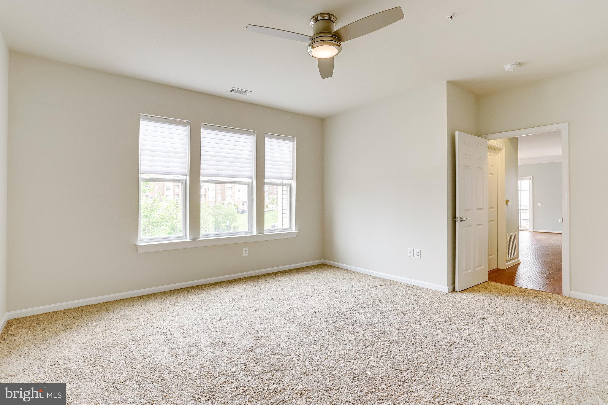 20580 Hope Spring Terrace, Unit 207 Ashburn, VA 20147 - Photo 21 of 61 a view of an empty room with a window