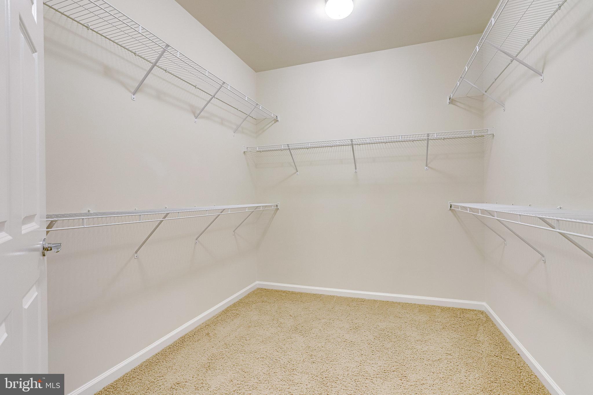 20580 Hope Spring Terrace, Unit 207 Ashburn, VA 20147 - Photo 24 of 61 a view of a room with racks on the wall