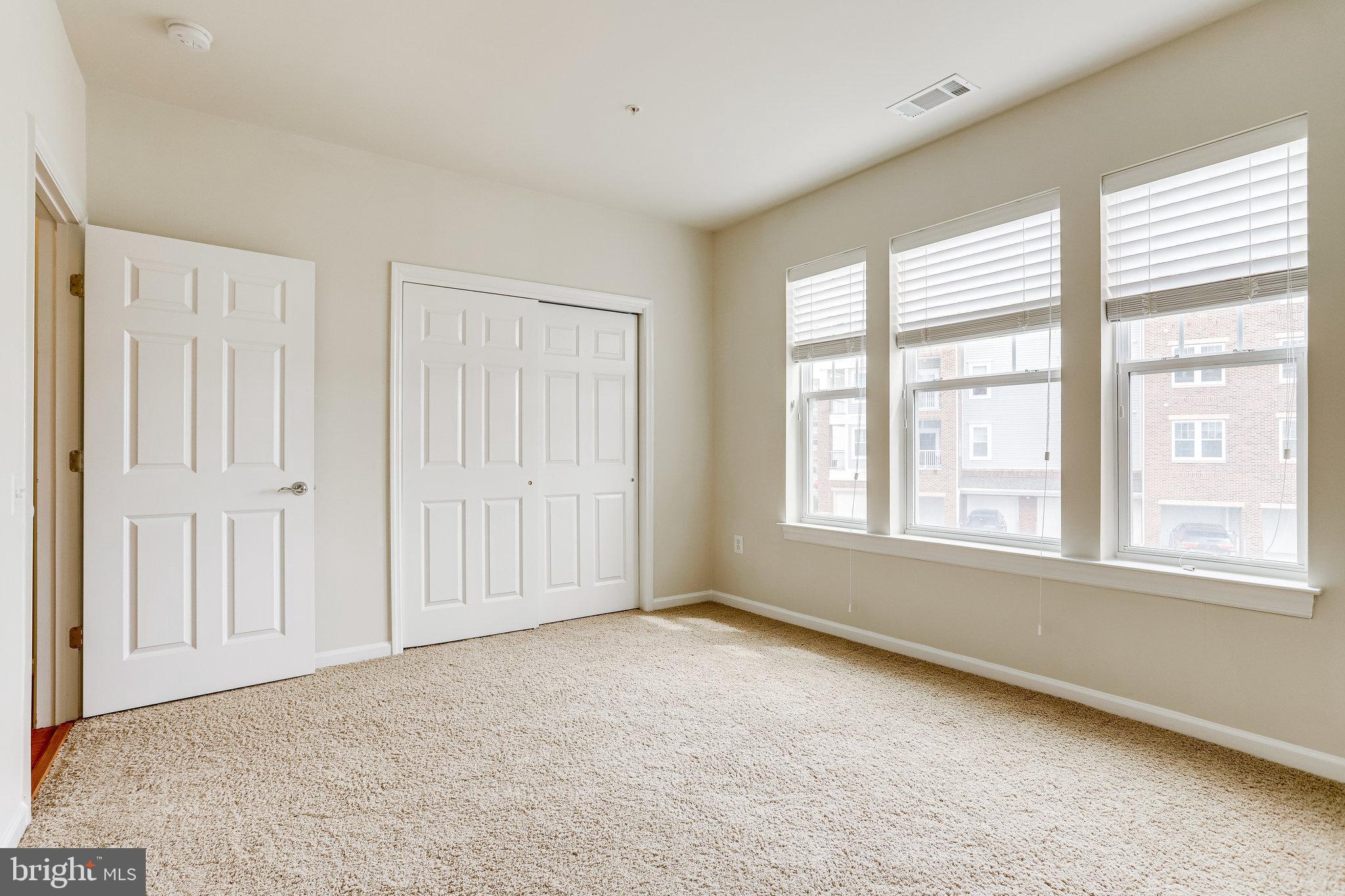 20580 Hope Spring Terrace, Unit 207 Ashburn, VA 20147 - Photo 26 of 61 a view of an empty room with a window