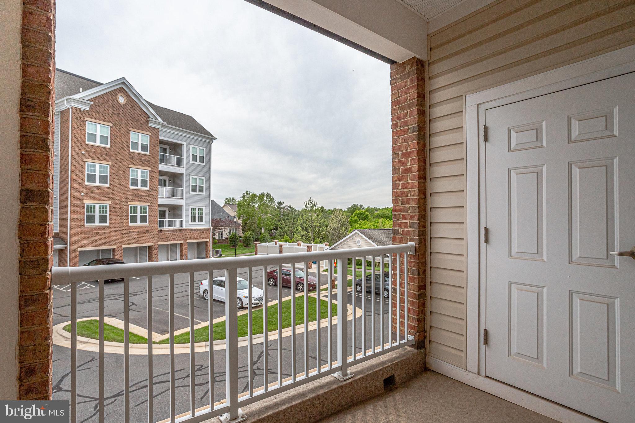 20580 Hope Spring Terrace, Unit 207 Ashburn, VA 20147 - Photo 33 of 61 a view of city from a balcony