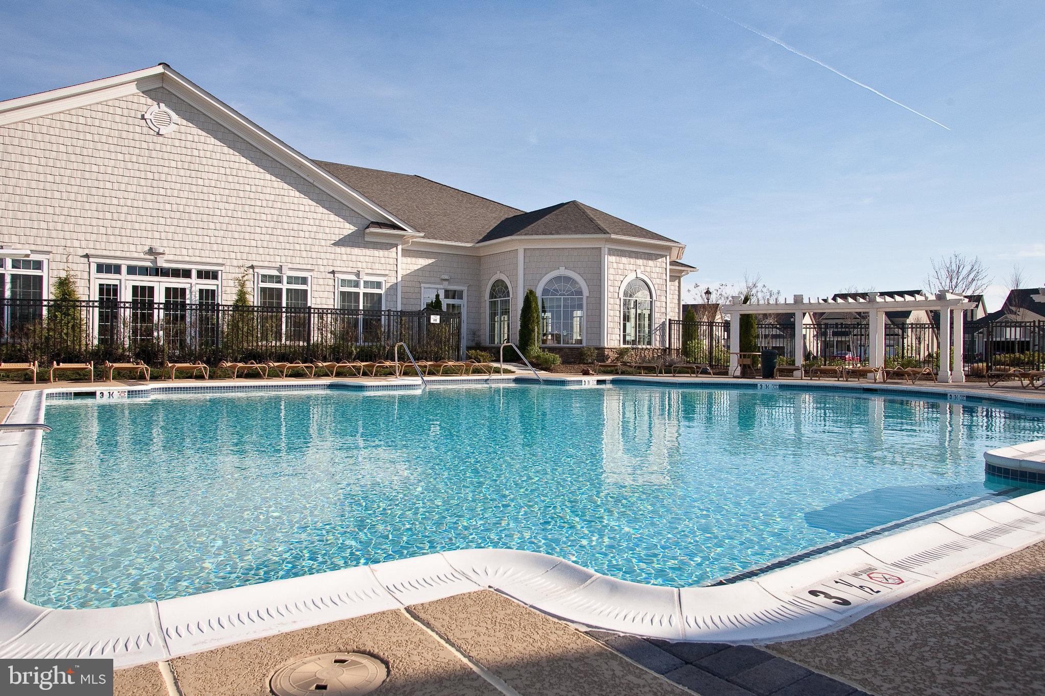20580 Hope Spring Terrace, Unit 207 Ashburn, VA 20147 - Photo 38 of 61 a view of a lake in front of the house