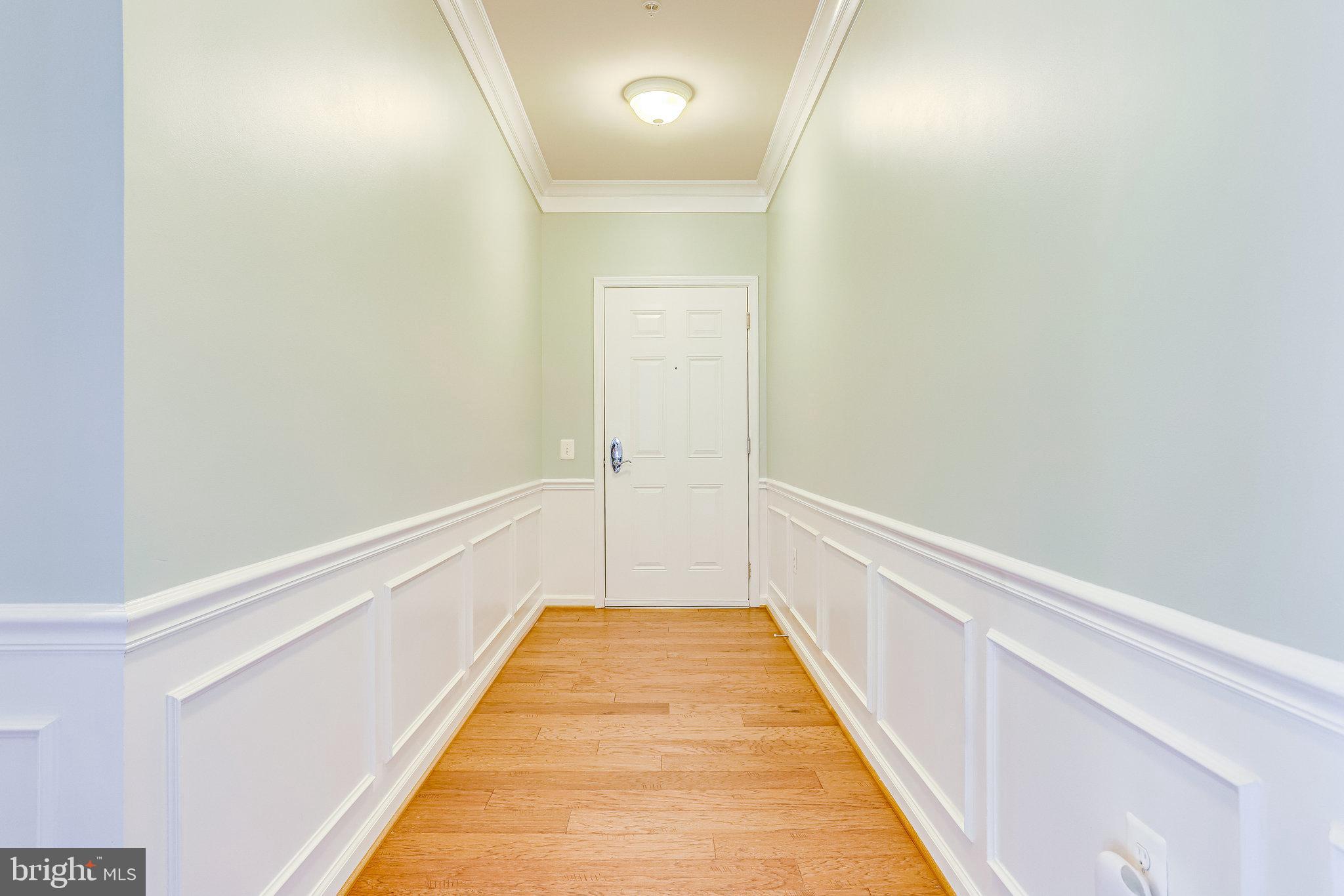 20580 Hope Spring Terrace, Unit 207 Ashburn, VA 20147 - Photo 5 of 61 a view of hallway with wooden floor