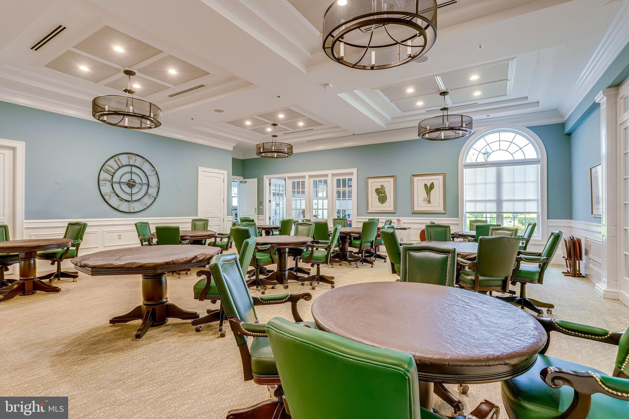 20580 Hope Spring Terrace, Unit 207 Ashburn, VA 20147 - Photo 48 of 61 a view of a dining room with furniture and a large window