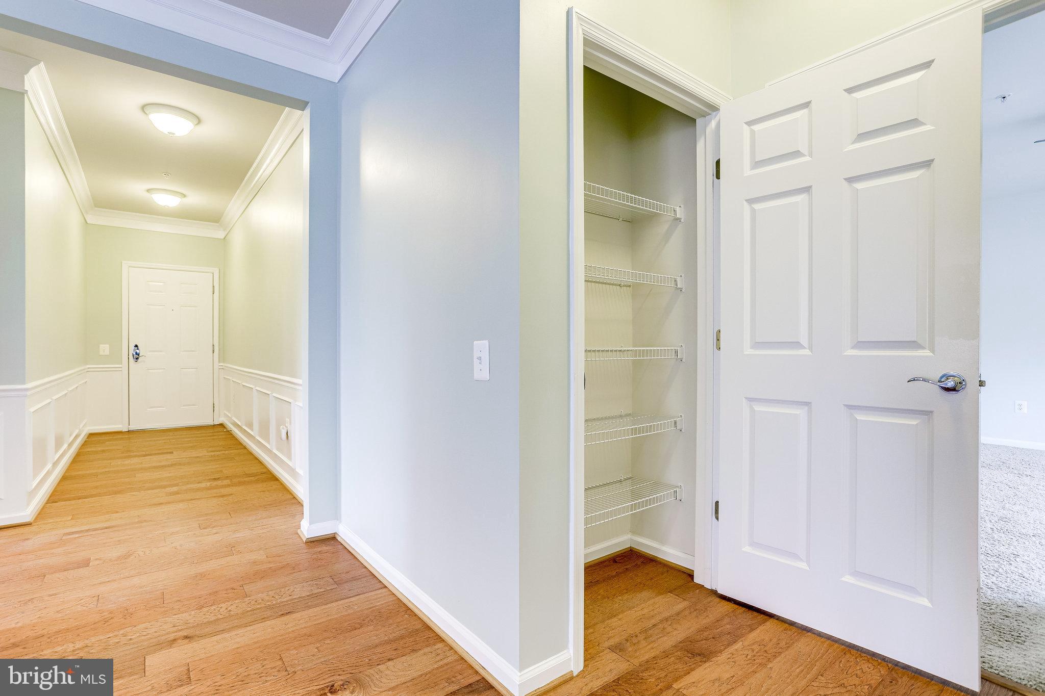 20580 Hope Spring Terrace, Unit 207 Ashburn, VA 20147 - Photo 6 of 61 a view of hallway with wooden floor