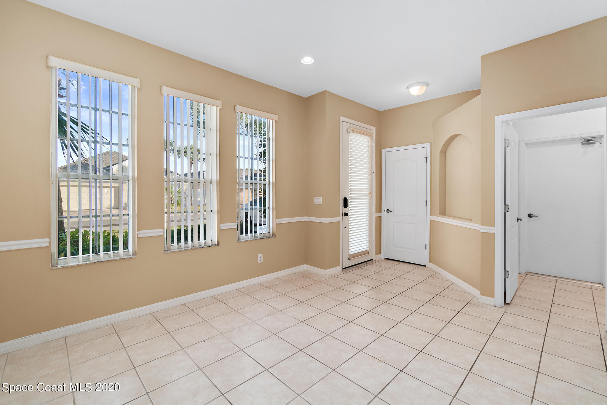 153 Babylon Lane Melbourne, FL 32903 - Photo 13 of 32 a view of an empty room and window