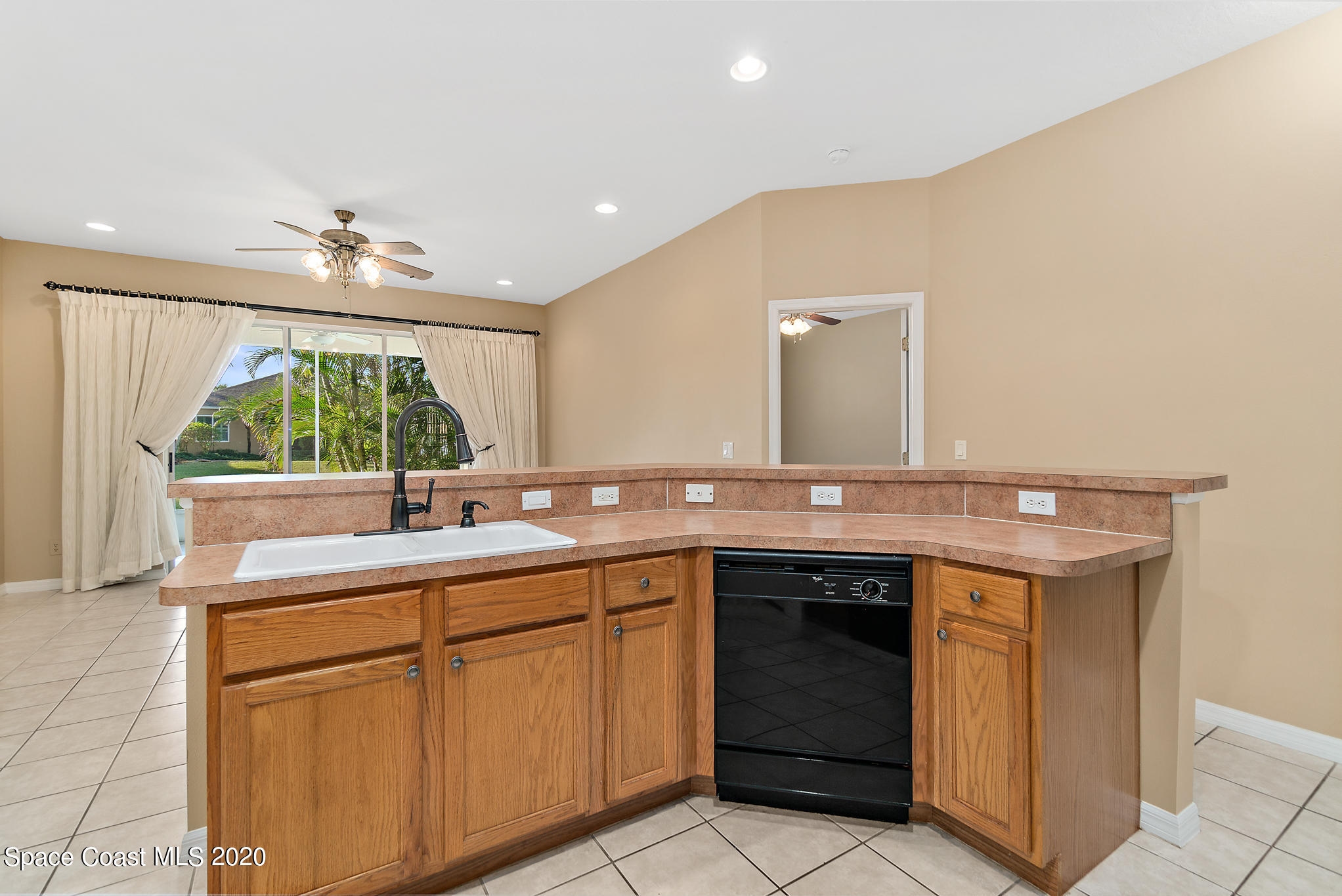 153 Babylon Lane Melbourne, FL 32903 - Photo 16 of 32 a bathroom with a sink and a mirror