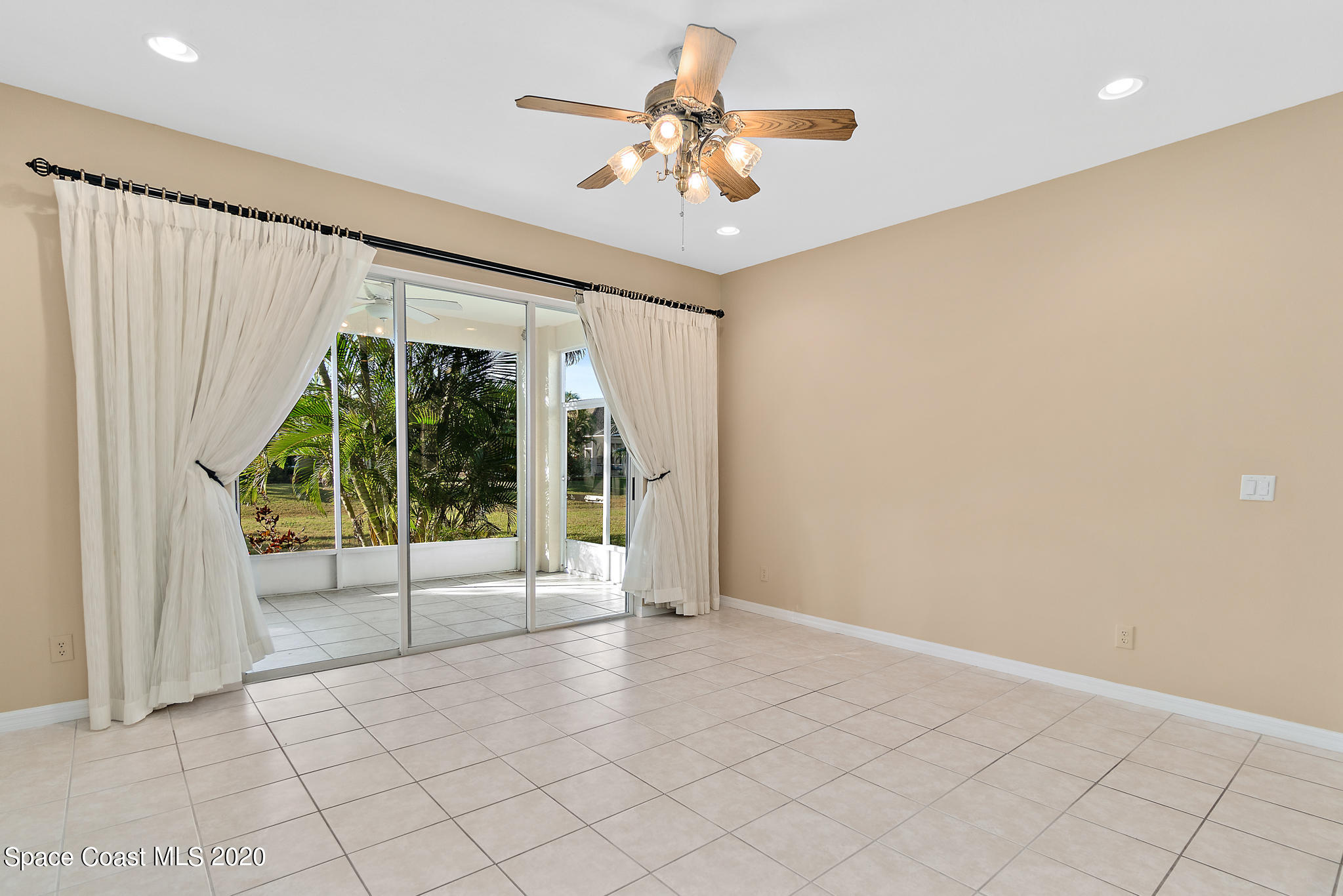 153 Babylon Lane Melbourne, FL 32903 - Photo 17 of 32 a view of an empty room with a window