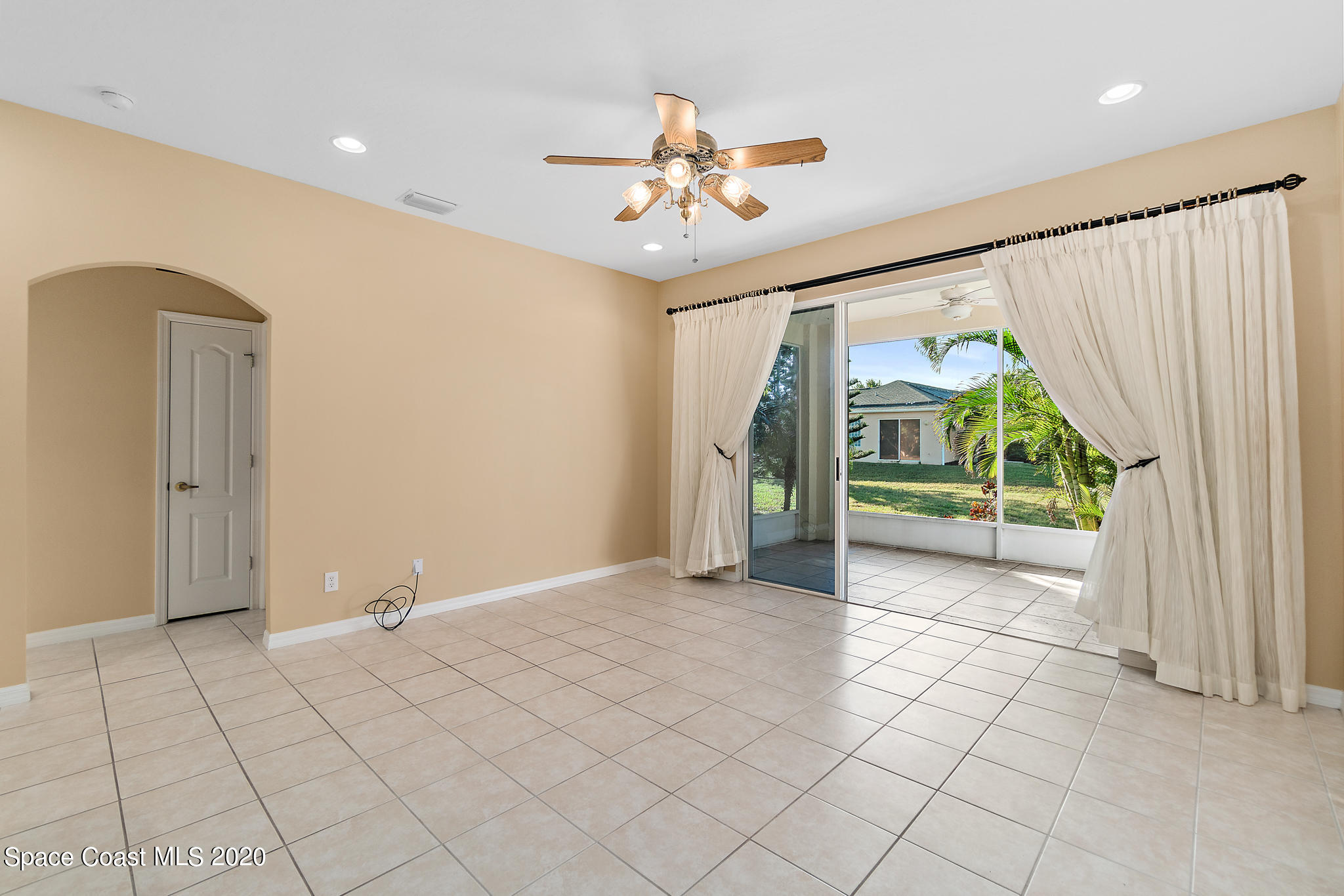 153 Babylon Lane Melbourne, FL 32903 - Photo 18 of 32 a view of an empty room with a window