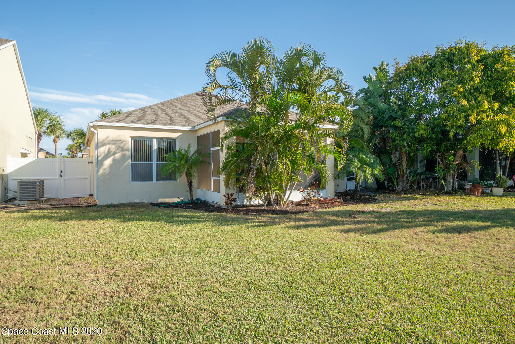 153 Babylon Lane Melbourne, FL 32903 - Photo 7 of 32 a view of a house with a swimming pool