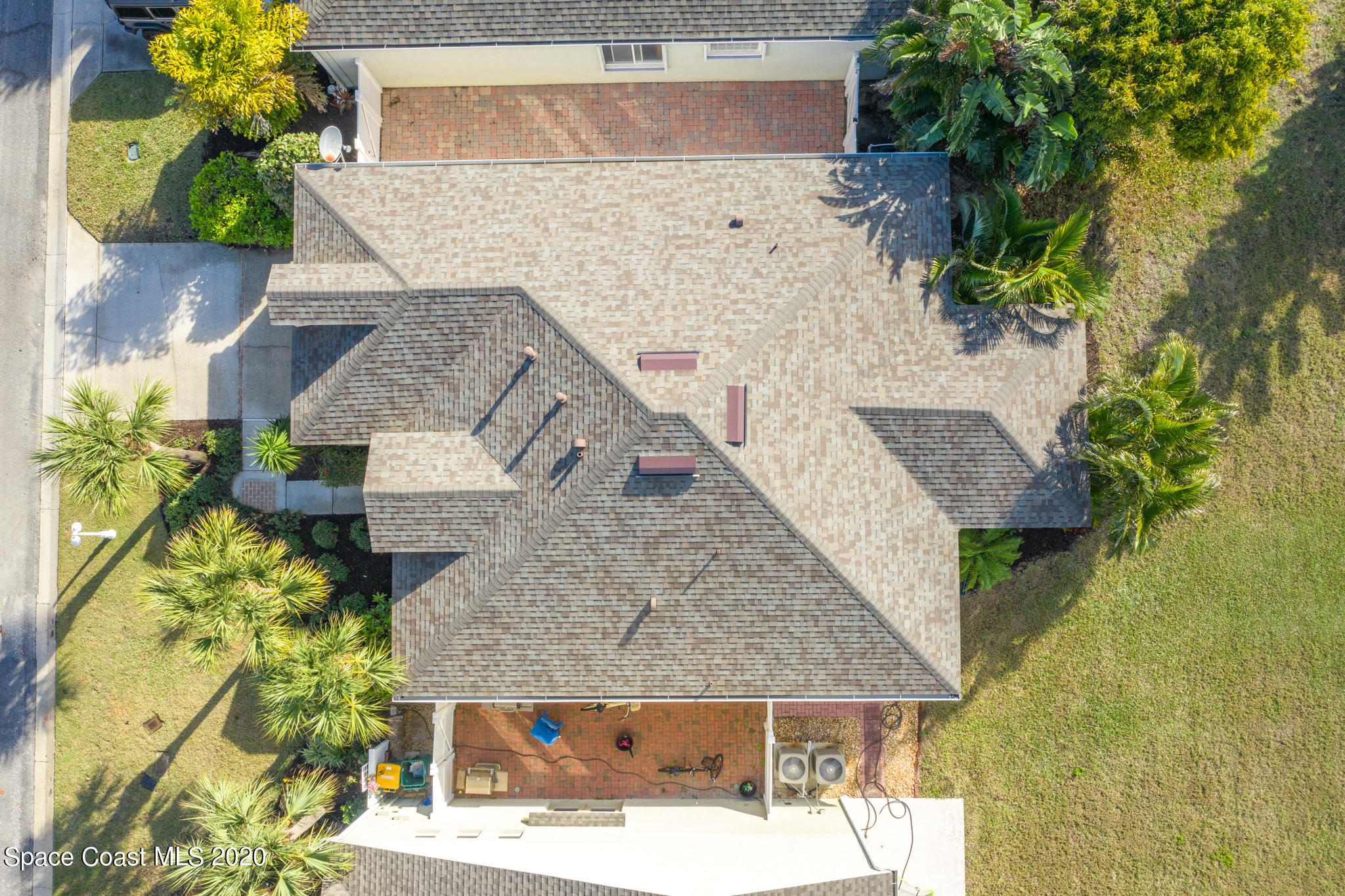 153 Babylon Lane Melbourne, FL 32903 - Photo 10 of 32 an aerial view of a house with a yard