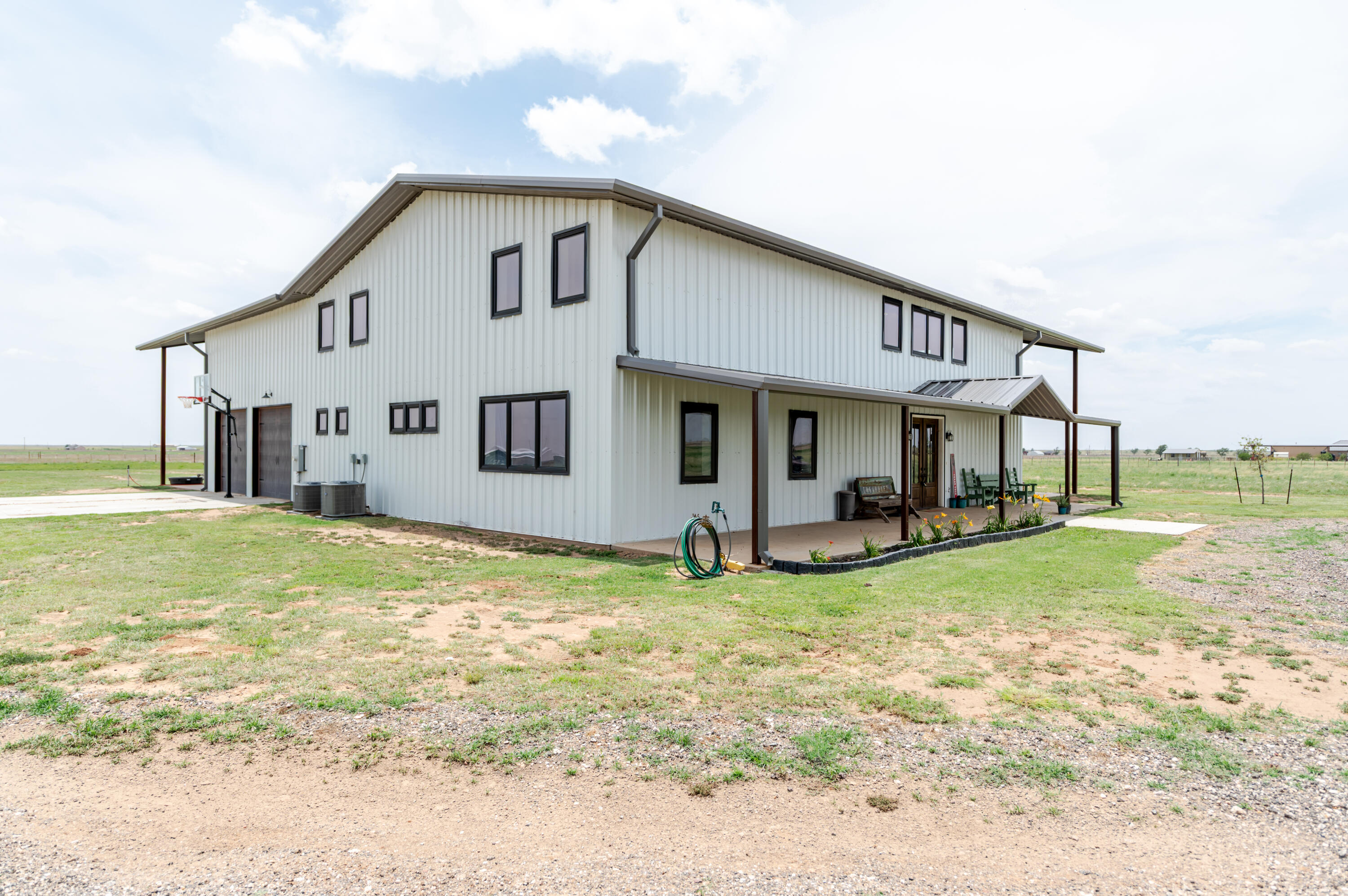 6792 Maine Road Anton, TX 79313 - Photo 60 of 77 a view of a house with a yard and sitting area