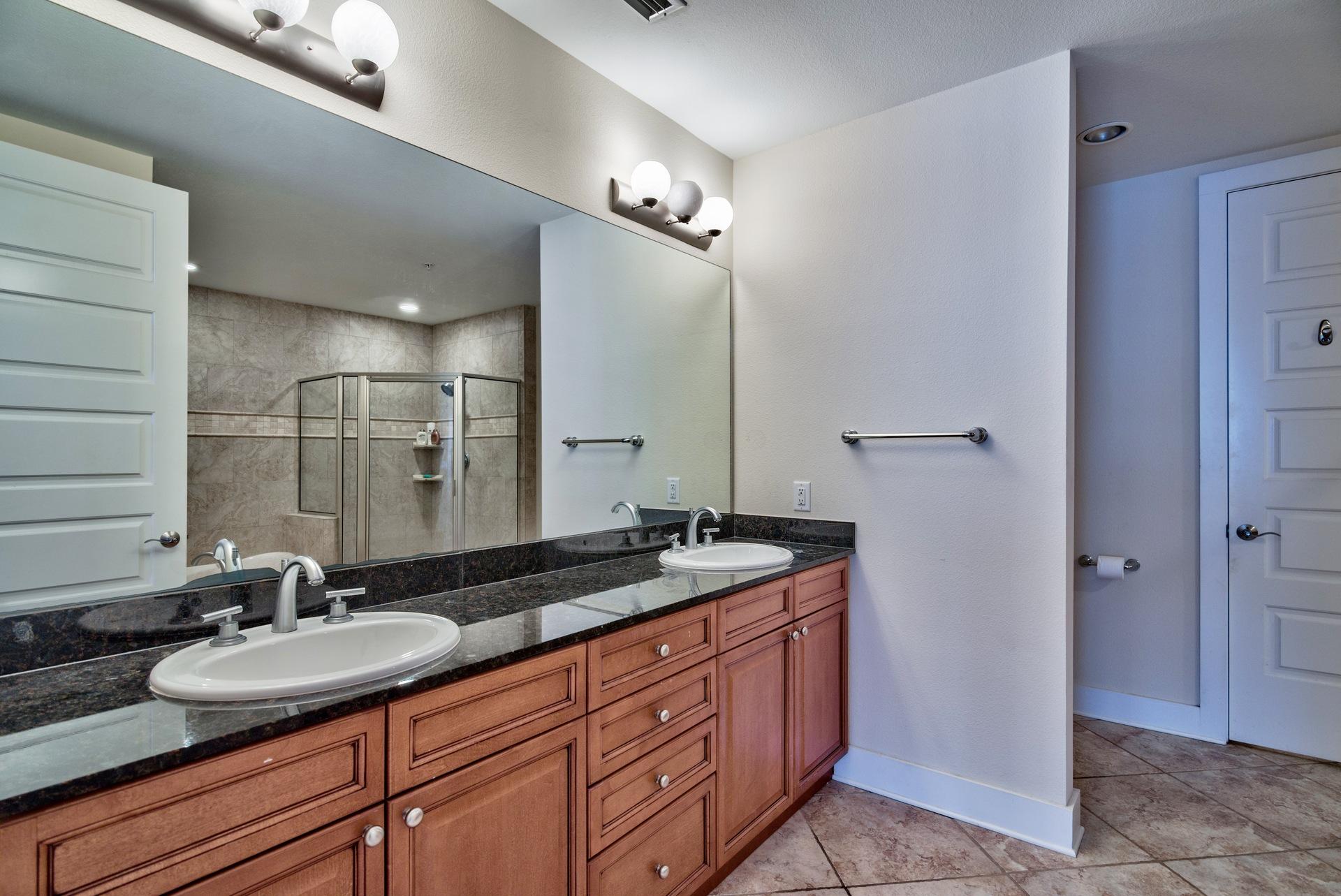 211 Durango Road, Unit 317 Destin, FL 32541 - Photo 17 of 47 a bathroom with double sink and a mirror