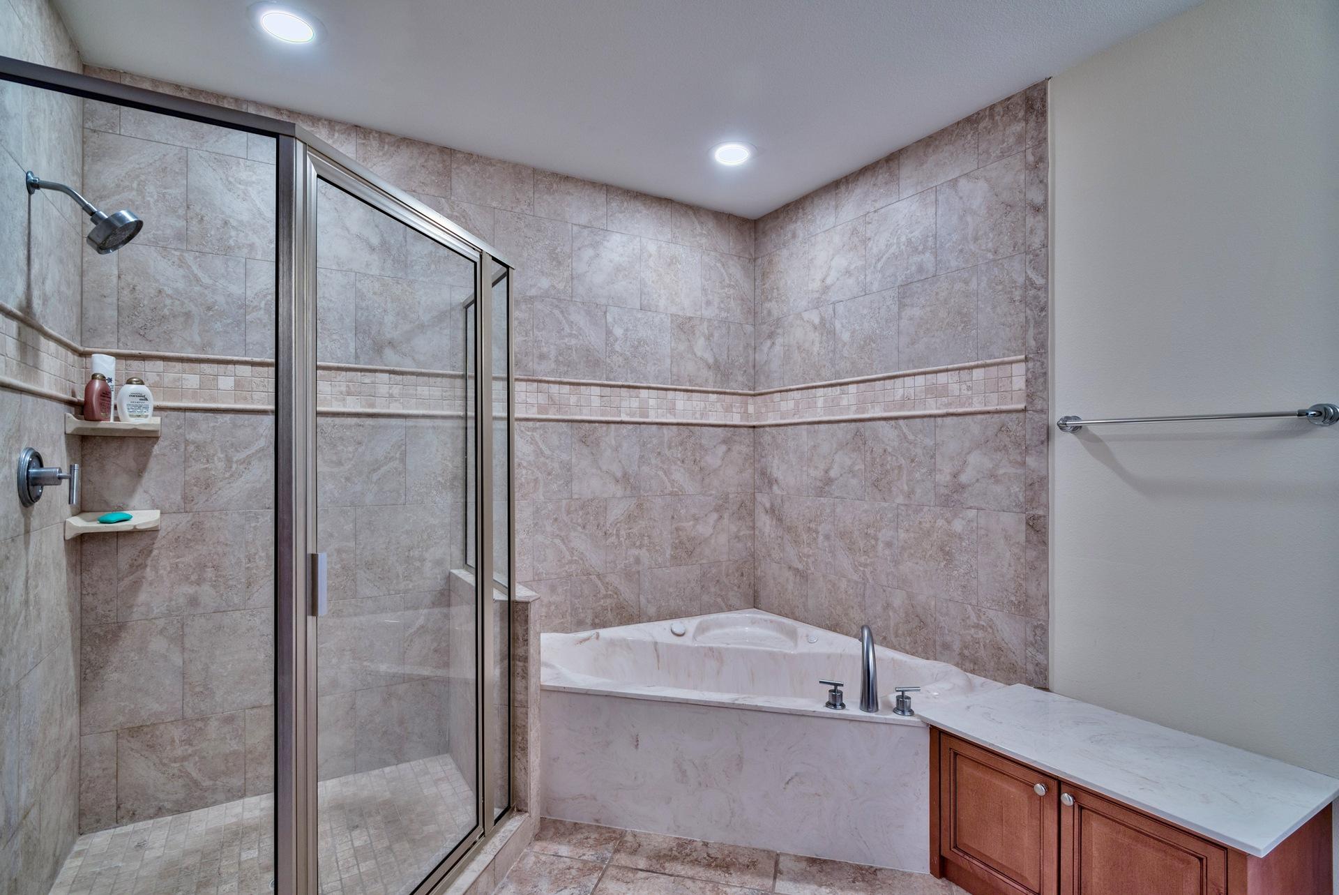 211 Durango Road, Unit 317 Destin, FL 32541 - Photo 18 of 47 a bathroom with a bathtub and shower