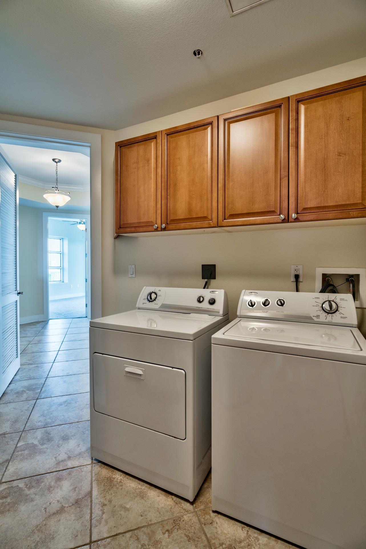 211 Durango Road, Unit 317 Destin, FL 32541 - Photo 31 of 47 a utility room with dryer and washer
