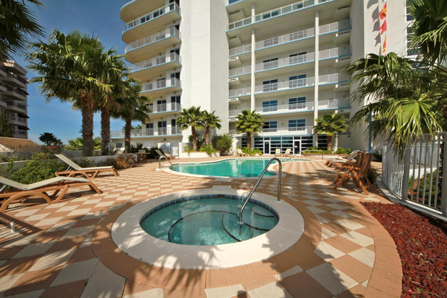 211 Durango Road, Unit 317 Destin, FL 32541 - Photo 38 of 47 a swimming pool with outdoor seating and yard