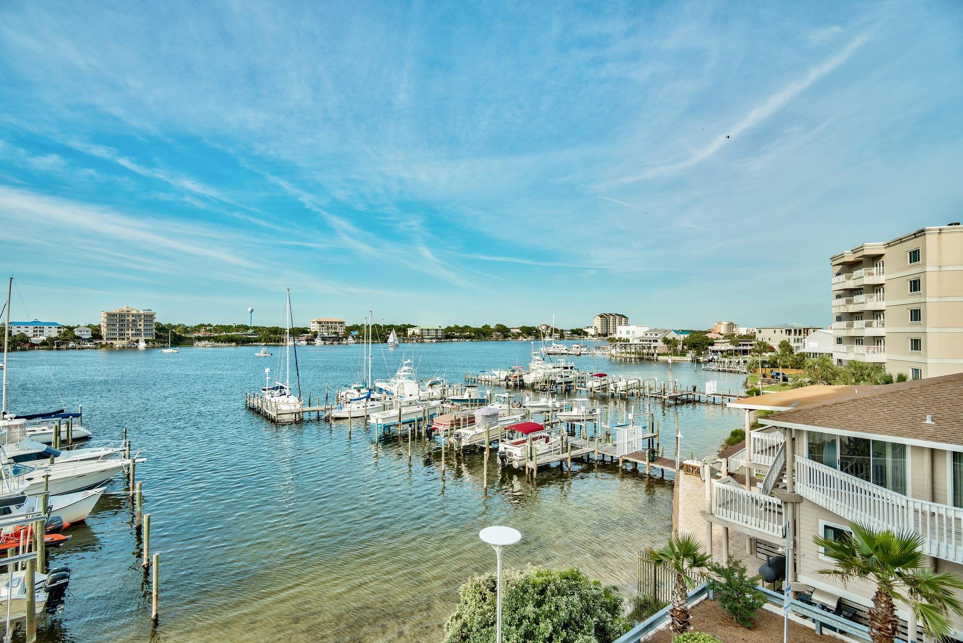 211 Durango Road, Unit 317 Destin, FL 32541 - Photo 46 of 47 a view of a lake with building in front of it