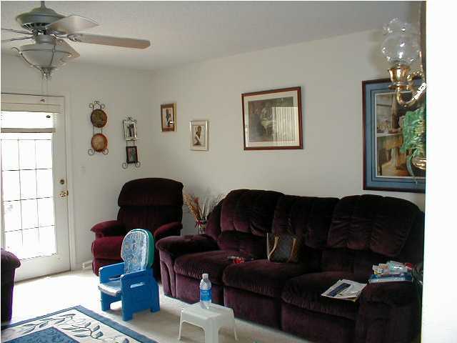 493 Keystone Road, Unit 493 Mary Esther, FL 32569 - Photo 4 of 9 a living room with furniture and a window