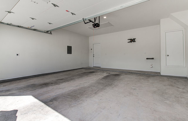 1237 Volente Lane Leander, TX 78641 - Photo 20 of 22 A spacious, clean garage providing ample room for vehicles and storage.