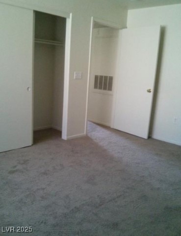 1851 Hillpointe Road, Unit 2112 Henderson, NV 89074 - Photo 14 of 15 Unfurnished bedroom featuring a closet, carpet flo