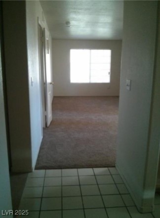 1851 Hillpointe Road, Unit 2112 Henderson, NV 89074 - Photo 2 of 15 Corridor with carpet floors and tile patterned flo