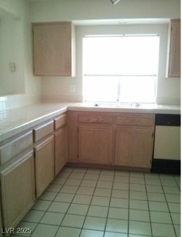 1851 Hillpointe Road, Unit 2112 Henderson, NV 89074 - Photo 4 of 15 Kitchen with dishwasher and light tile patterned f