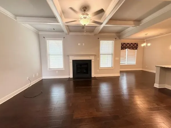 a bathroom with a granite countertop sink a toilet and a mirror