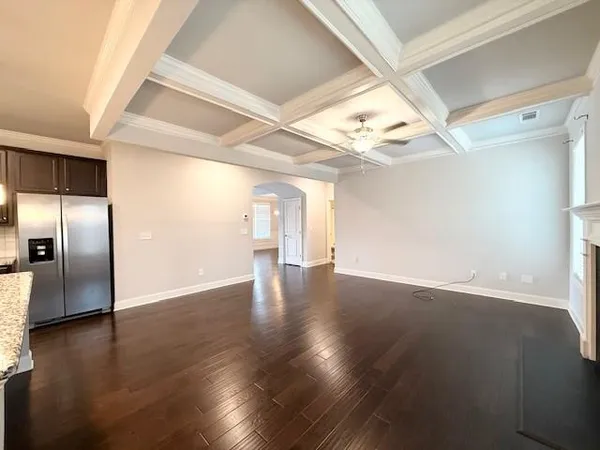 a spacious bathroom with a double vanity sink a large mirror and a shower