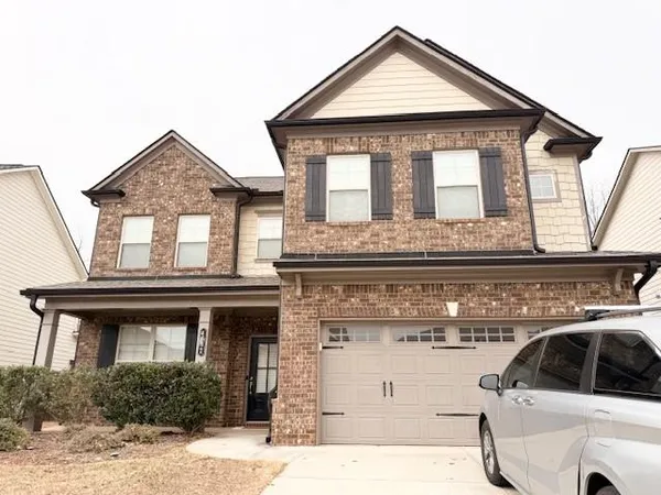 a kitchen with stainless steel appliances granite countertop a sink refrigerator and microwave